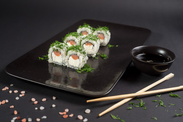 White japanese sushi on black background