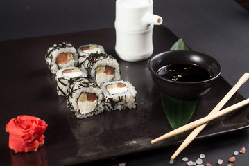 White japanese sushi on black background
