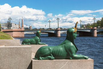 Green sphinxes at the pier on the river Malaya Nevka. Saint Petersburg, Russia