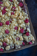 home made chocolate brownies with raspberries and streusel