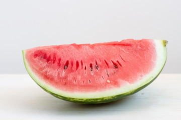 a slice watermelon on white table