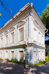 Fototapeta na wymiar two-storey classic light blue house. Vintage architecture of the 19th century