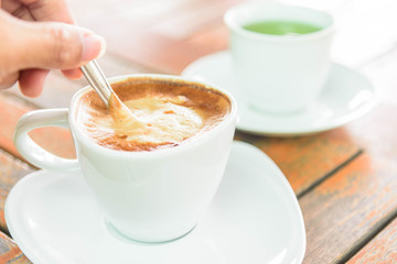stir the coffee in cup and take to drink