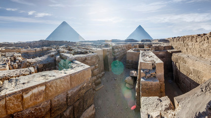 Giza pyramids in Cairo, Egypt. View from the north of the pyramids, with the ruins of numerous...