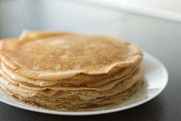 Traditional russian pancakes. Thin homemade pancakes with crispy crust. Maslenitsa holiday.