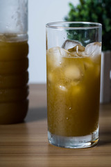 filling an empty ice cold glass with sugar cane