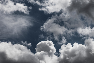 white clouds on dark blue sky background