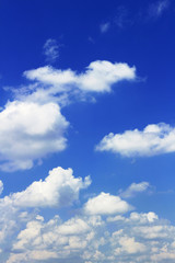 Landscape of cumulonimbus clouds floating in sunny summer sky