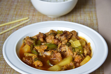 Sour-and-sweet pork with rice, a traditional Chinese dish.