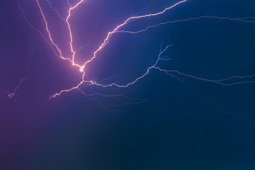 Thunderclouds with lightning in the night sky