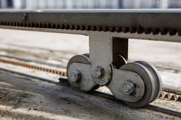 Sliding door casters and concrete floor outside house ,with lighting and shadow.