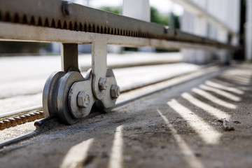 Sliding door casters and concrete floor outside house ,with lighting and shadow.