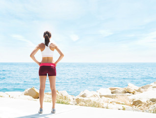 Young, fit and sporty girl training in outdoor gym. Fitness, sport and healthy lifestyle.