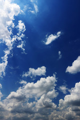 Landscape of cumulonimbus clouds floating in sunny summer sky