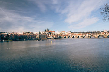 Praha city panorama with Vltava river, Karluv most bridge and Prazsky hrad castle from Smetanovo nabrezi in Czech republic