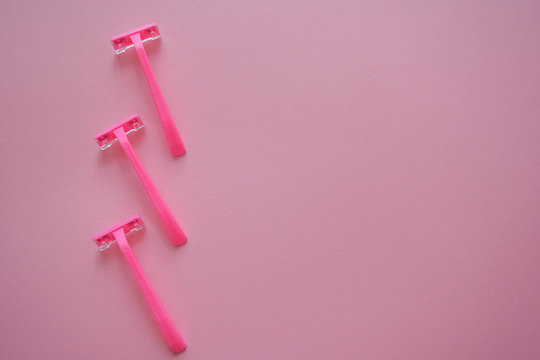 Means for hair removal on a colored background. Modern razor on a colored background. Removal of unwanted hair. Minimalism, choice, top view, flatlay. © Inna