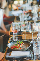 Close-up of food and wine glass on dining table in restaurant