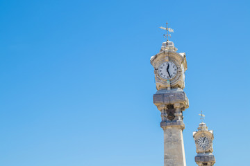 Fototapeta na wymiar clock tower on the beach of the shell, san sebastian, spain