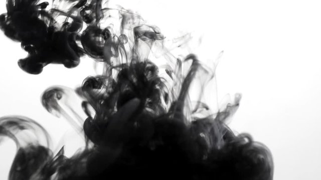 Swirling clouds of black ink falling