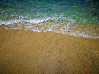 Ocean waves and sandy beach