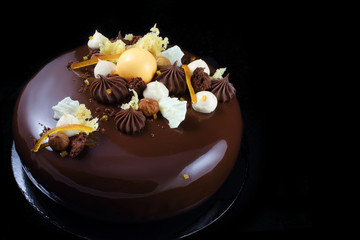 Orange chocolate cake with chocolate ganache and whipped white chocolate cream