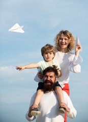 Garden party in America. Dad mom and son playing together. Family dreams of traveling. Father...