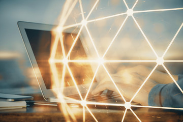 Social network theme hologram with businessman working on computer on background. Concept of world...