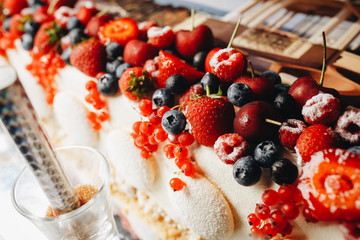 Victoria Sandwich Cake Decorated With Fresh Summer Berries And Mint In The Form Of A Wreath