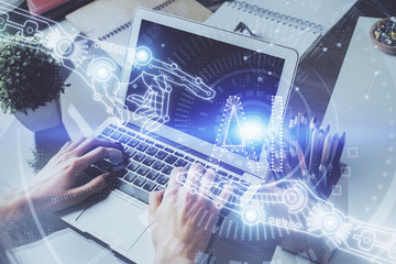 Multi exposure of technology hologram with man working on computer background. Concept of big data.