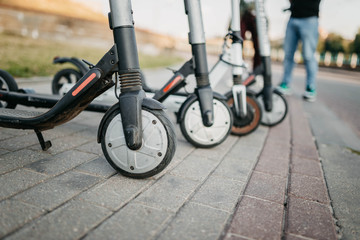 Electric scooter rental in the city. The problem of traffic jams, environmental transport in the city.