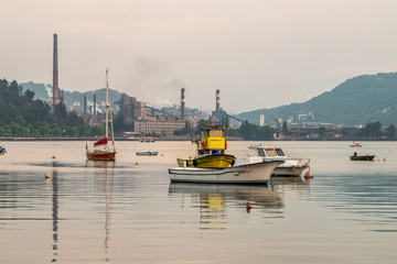 Zonguldak eregli district, fishing boats and erdemir iron and steel factory behind June 24,2019, Eregli, Zonguldak, Turkey