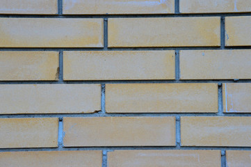 The peach texture of the facade of the building  - aged brick wall
