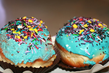 Beautiful multicolored Hanukkah donuts. Pastry decoration on donuts.