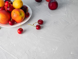 Beautiful ripe fruit on a white plate.