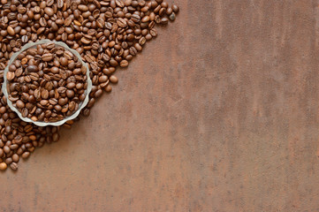 Coffee beans on rusty, scratched metal