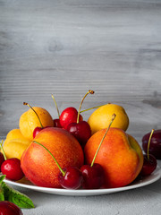 Beautiful ripe fruit on a white plate.