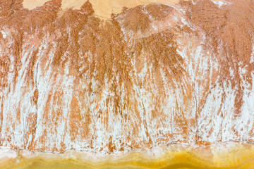 Sand covered with salt, texture. Snow on waste banks