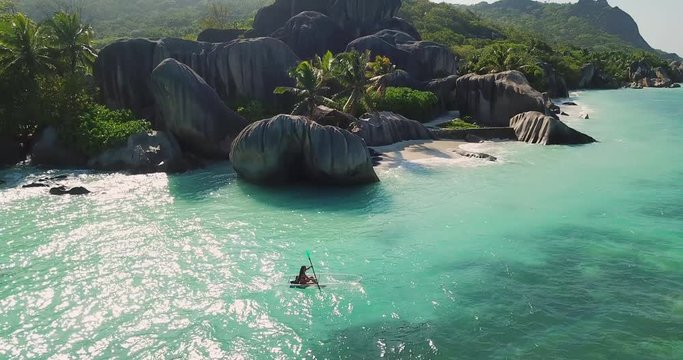 Aerial Descending: Clear Kayaking Near the Shores of La Digue Seychelles Beach