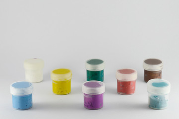 Bright Isolated small cans with gouache and acrylic paint