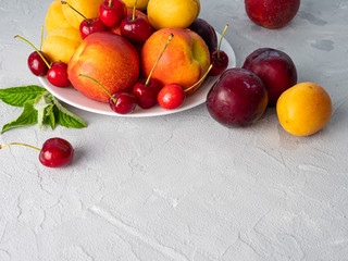 Beautiful ripe fruit on a white plate.