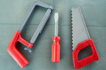 toy instruments tools on a neutral background