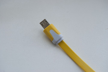 macro yellow and white usb connector wire
