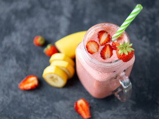 Strawberry smoothie or milkshake on the table with copyspace. Summer red Breakfast