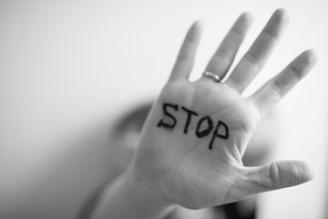 Woman shows palm with the inscription on the palm 