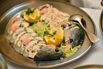 Stuffed trout sliced in a stainless steel bowl