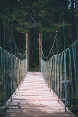 Ropes bridge over small river perspective shot in Spain