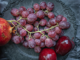 Decorative eastern dish with natural fruits, view from above.