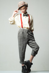 teen girl in retro male suit. retro fashion model. vintage charleston party. suspender and bow tie....