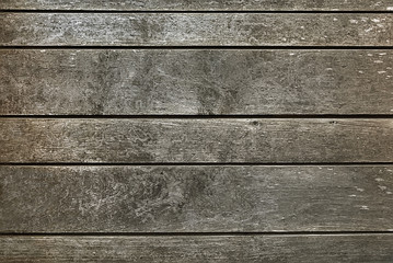 Old dark grey wooden fence background texture