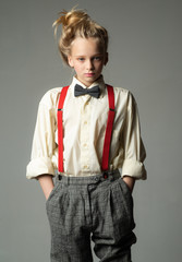 Funky style. suspender and bow tie. old fashioned child. vintage english style. retro fashion...